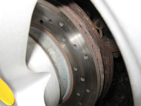 1996 Ford Probe - This image shows a car's brake rotor and caliper, not a specific vehicle model.