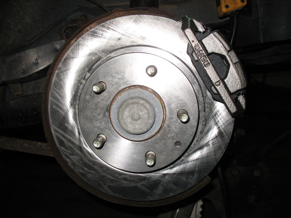 Brake rotor with caliper showing text 'MK60 D'