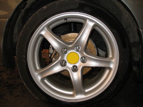 1996 Ford Probe - Close-up of a car's wheel, showing the alloy rim and brake components.