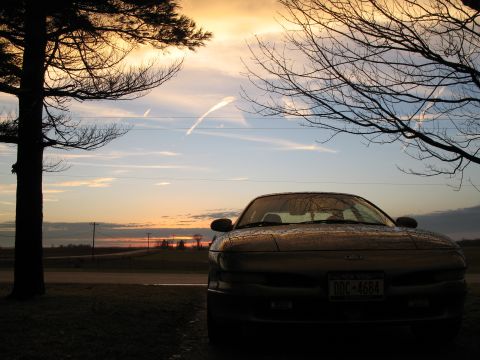 1996 Ford Probe - Front view of a 1996 Ford Probe parked with a sunset in the background.