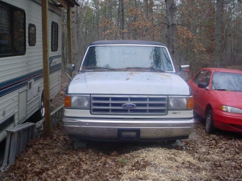 1988 Ford Bronco - This white Ford Bronco appears to be from the late 1980s, not a 1988 model, and is parked outdoors.