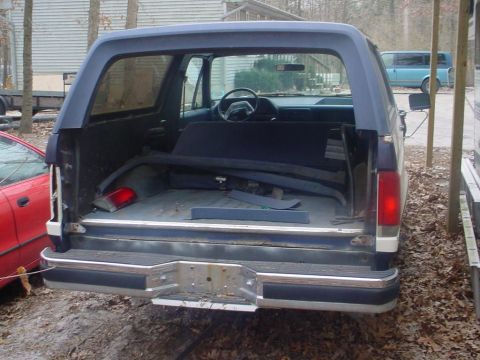 1988 Ford Bronco - Rear view of a 1988 Ford Bronco, showing the cargo space and interior.