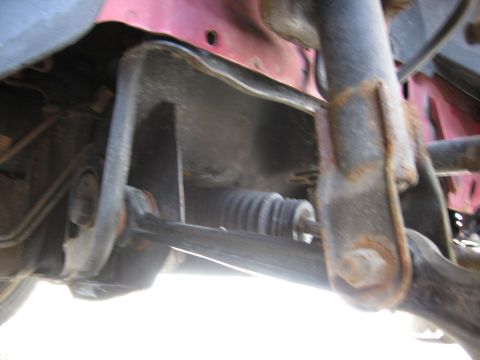 1995 Ford Thunderbird - A close-up view of the underside of a vehicle, focusing on suspension and steering components.