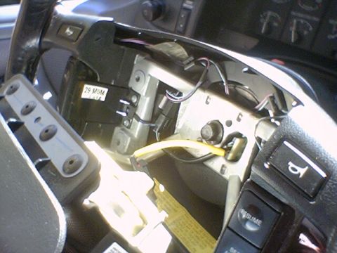 1994 Ford Bronco - Close-up view of the clock spring mechanism, showing wiring and a labeled component.
