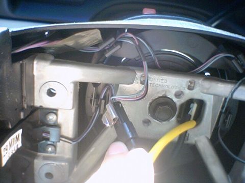 1994 Ford Bronco - Close-up view of the steering column wiring harness and associated components.