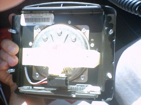 1994 Ford Bronco - Close-up of a vehicle's clock spring assembly, showing internal components and labels.