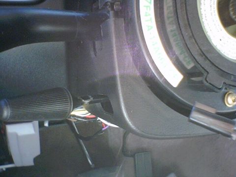 1994 Ford Bronco - Detail of the steering column's clock spring and associated wiring harness.