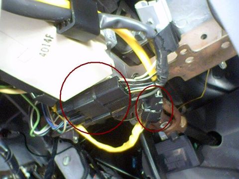 1994 Ford Bronco - Close-up view of vehicle wiring harness and electrical connectors, with red circles highlighting specific components.