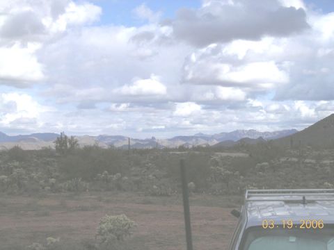 1994 Ford Bronco - The date 03.19.2006 is visible on the windshield of an SUV in a desert scene.