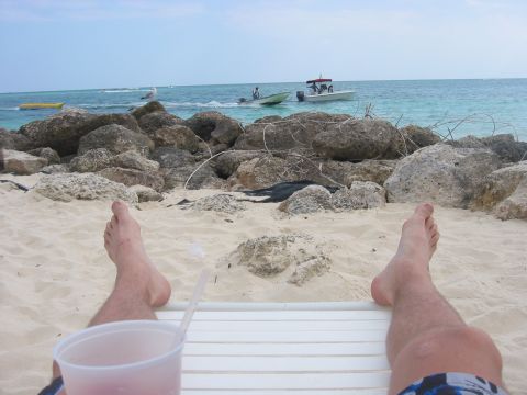 1989 Ford Bronco - Relaxing on the beach with a drink, watching boats on the turquoise water.