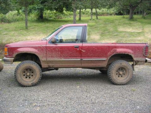 1991 Ford Explorer - This modified 1991 Ford Explorer pickup truck features a lifted suspension and aggressive off-road tires.