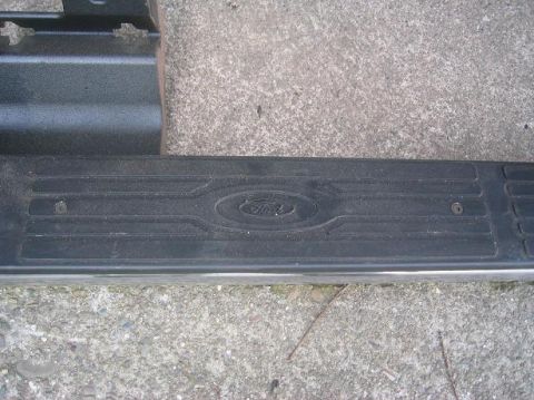 1986 Ford Bronco - The running board features the Ford logo embossed in the center.