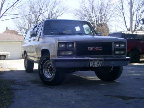 1985 Ford Bronco - This GMC Suburban appears to be from the mid-1980s, possibly 1985, based on its grille design.