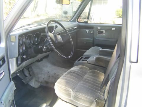 1985 Ford Bronco - Interior view of a truck, showing the dashboard, steering wheel, and seats.