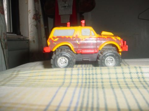 1988 Ford Bronco - This toy truck has oversized wheels and a lifted body, resembling a monster truck.
