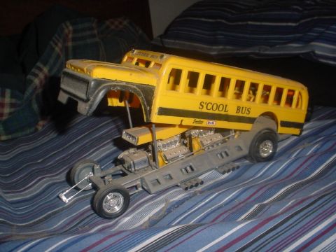 1988 Ford Bronco - A model school bus body is shown mounted on a custom drag racing chassis with dual engines.