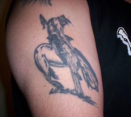 1970 Mercury Cougar - A black and white tattoo of a dog is visible on a person's arm.