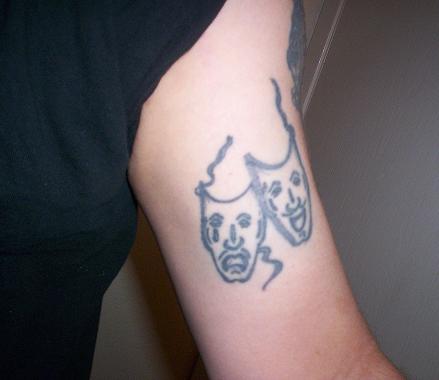 1970 Mercury Cougar - A tattoo of the comedy and tragedy masks is visible on a person's arm.