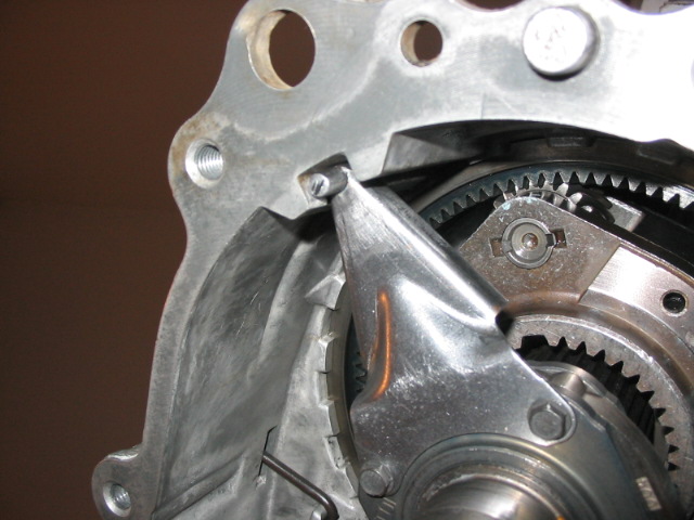Close-up of transmission internals showing gears and machined aluminum housing