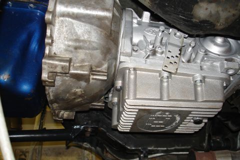 1981 Ford Mustang - Close-up view of transmission and engine components, showing a Ford logo on the oil pan.