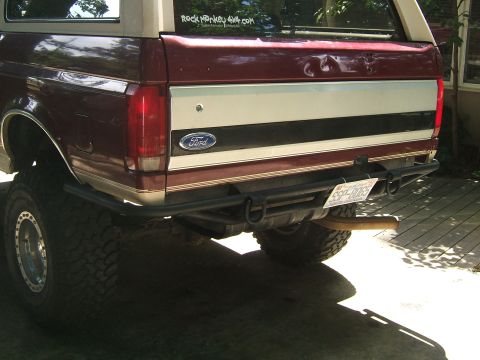 1993 Ford Bronco - The rear view of a 1993 Ford Bronco shows its custom bumper and large off-road tires.
