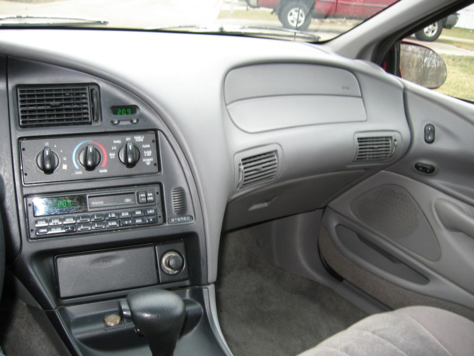 Interior dashboard with digital clock showing 20:01 and aftermarket stereo
