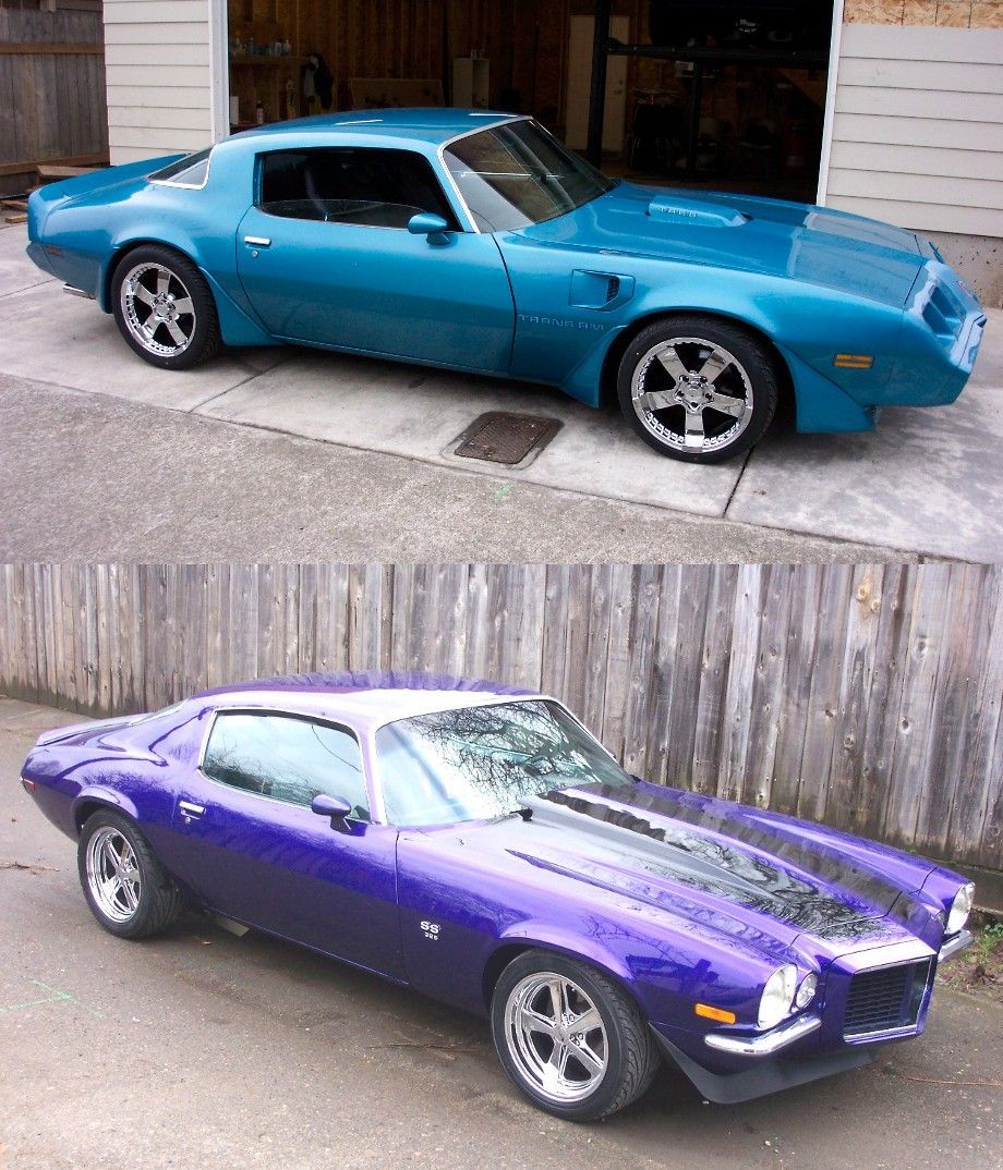 Blue 1970s Pontiac Trans Am parked in driveway, purple 1970s Chevrolet Camaro parked outside