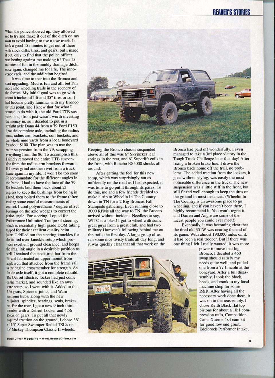 Lifted Ford Bronco parked in a grassy field with trees in the background