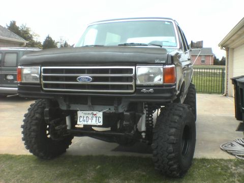 1991 Ford Bronco - This 1991 Ford Bronco features a substantial body lift and oversized tires, giving it an imposing stance.