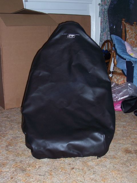 1988 Suzuki Samurai - A black PRP seat cover is shown, obscuring the details of the car seat it covers.