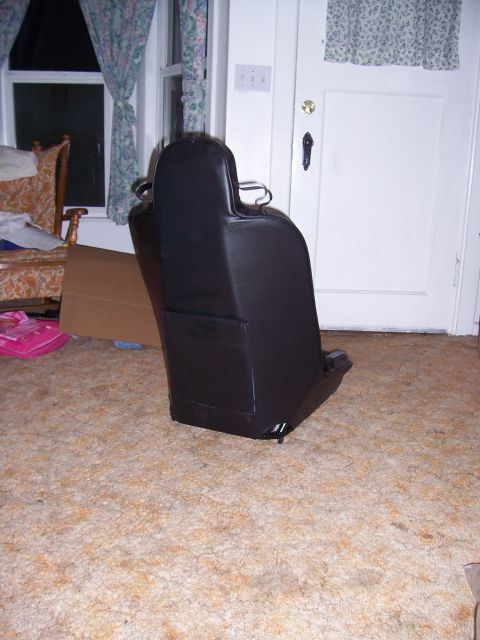 1988 Suzuki Samurai - A single car seat is shown indoors, not a 1988 Suzuki Samurai.