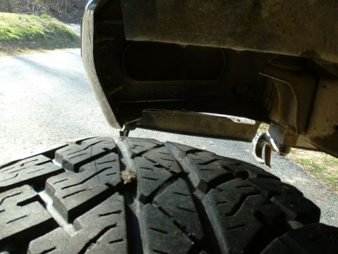 1991 Ford Bronco - Underside view of a vehicle, showing the tire and frame components.