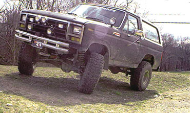 1986 Ford Bronco - Ford Bronco from the 1980s shown with a lifted suspension and off-road tires.