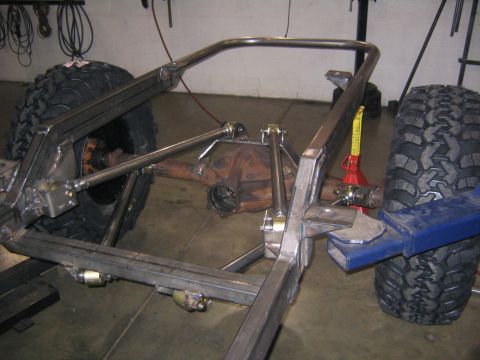 1978 Ford Bronco - Custom suspension and frame modification in progress, showing linkage and differential.