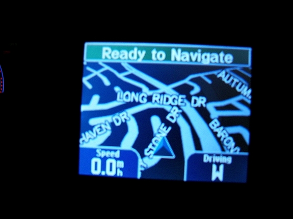 2000 Midnight Black Ford Taurus SES 4-Door Sedan - Garmin Streetpilot i5 GPS at night from TheGPSStore.com