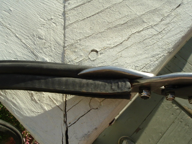 cut off the squishy part, leave the metal sleeved part that goes around the trunk lip