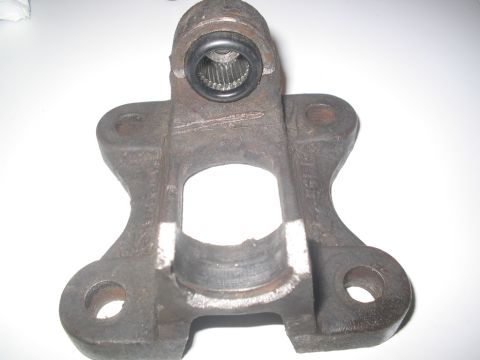 1990 Ford Bronco - This is a close-up of a rusty metal automotive part, likely a component from a drivetrain.