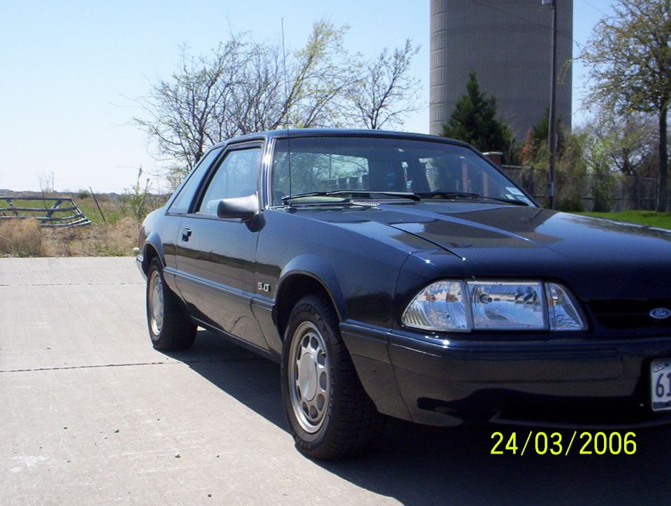 Dark blue 1991 Ford Mustang coupe with 5.0 badge