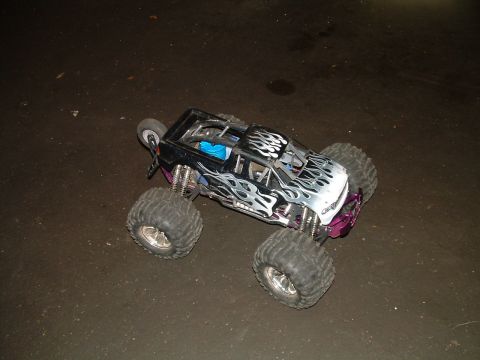 1994 Ford Bronco - This remote control monster truck features flame decals and large tires, not a 1994 Ford Bronco.