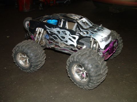1994 Ford Bronco - This remote control monster truck features flame decals and large off-road tires.