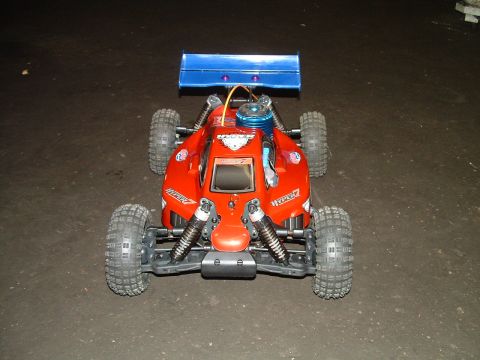1994 Ford Bronco - This remote control buggy features a bright red body and a prominent blue rear spoiler.
