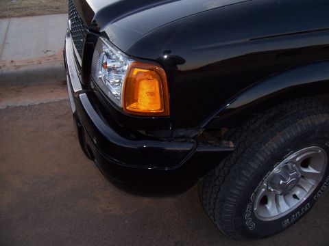 2003 Ford Ranger - Front corner view of a black 2003 Ford Ranger pickup truck.