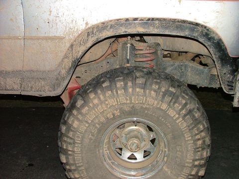 1985 Ford Bronco - See how far the tire sits back in the wheel well... it should be centered. It took a pretty good hit on this side to do it.