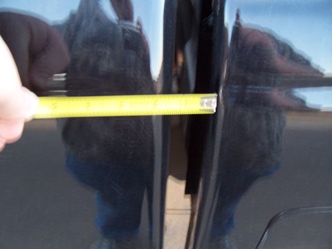 2003 Ford Ranger - Measuring the panel gap between car doors.