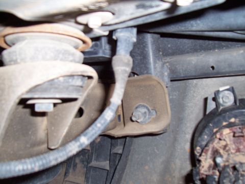 2003 Ford Ranger - Detail of a vehicle's undercarriage, focusing on suspension parts and electrical connections.