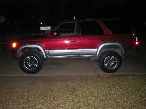 1996 Toyota 4Runner - This 1996 Toyota 4Runner is shown from the side, aftermarket wheels and silver body trim.