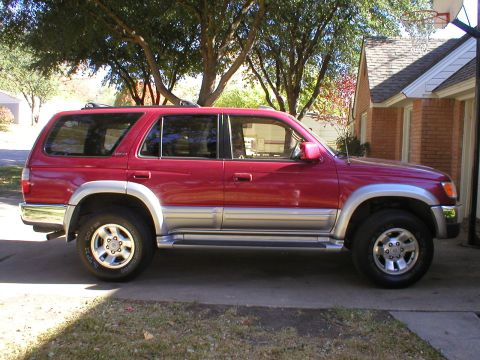 1996 Toyota 4Runner - This 1996 Toyota 4Runner is shown from the side, parked in a driveway on a sunny day.