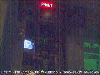 1995 Ford Bronco - A building facade at night features a red neon sign that reads 'PHANT'.