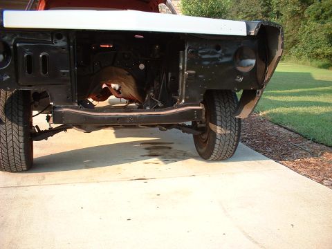 1967 Ford Ranchero - The front end of a vehicle is shown disassembled, revealing the chassis, suspension, and tires.