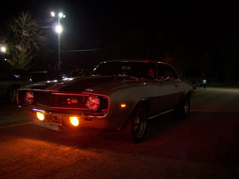 1994 Ford Probe - A 1969 Chevrolet Camaro Z/28 is seen at night, illuminated by orange lights.